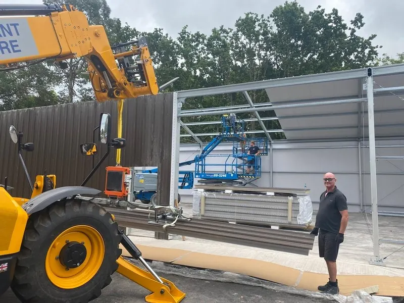 A white steel-framed temporary building with a PVC roof